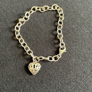 Sterling silver charm bracelet with heart charm
